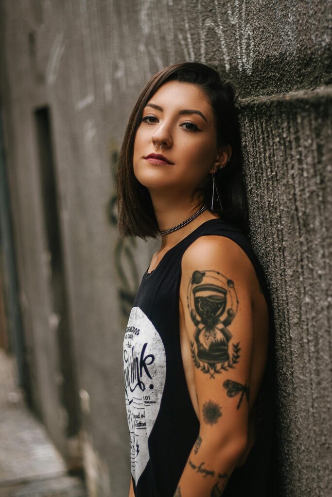 Portrait of a stylish tattooed woman in São Paulo, Brazil, exuding confidence and elegance.